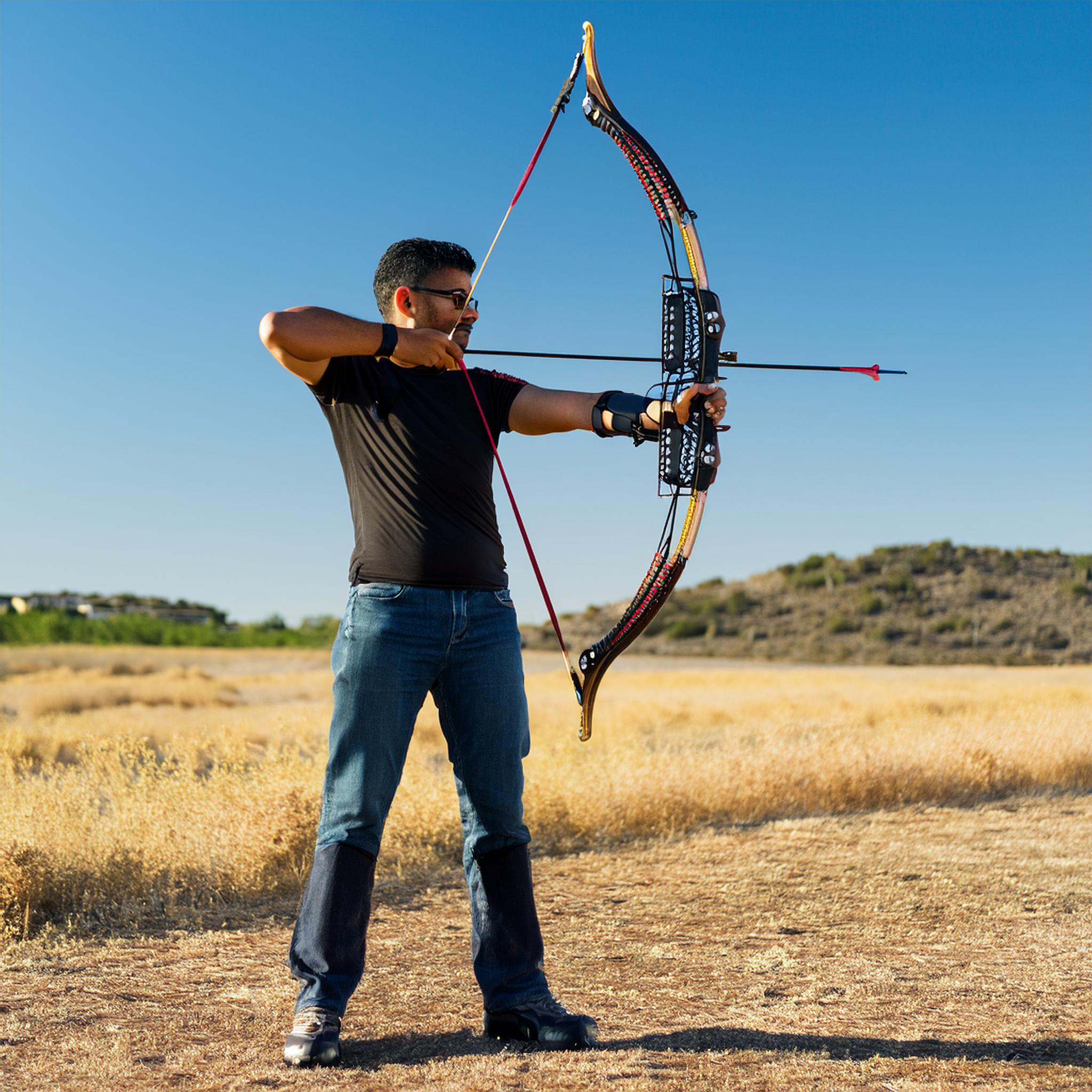 Fotobox Momentwerk - Firefly Create an image of a man resembling the one in the photo, holding a bow, standing on a wide  